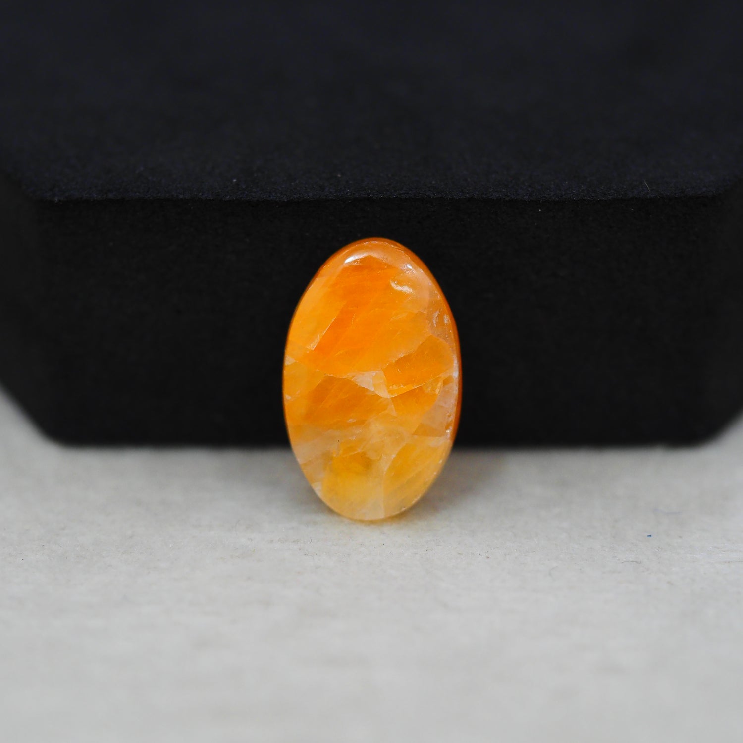 Natural Orange Calcite Oval Cabochon 19x12mm 10.5ct - warm honey-orange - Pedra Gems.