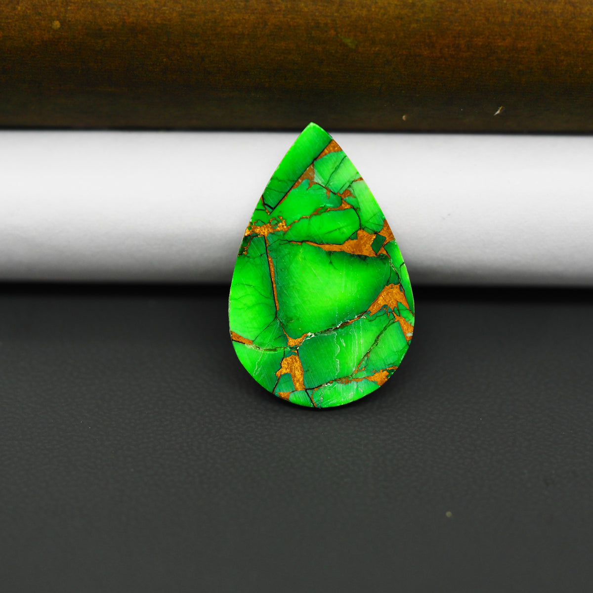 Natural Emerald Dahlia Pear Cabochon 26x17mm 15ct - vivid green with copper matrix, ships to Europe, Japan, Canada, Australia, NZ & worldwide - Pedra Gems.