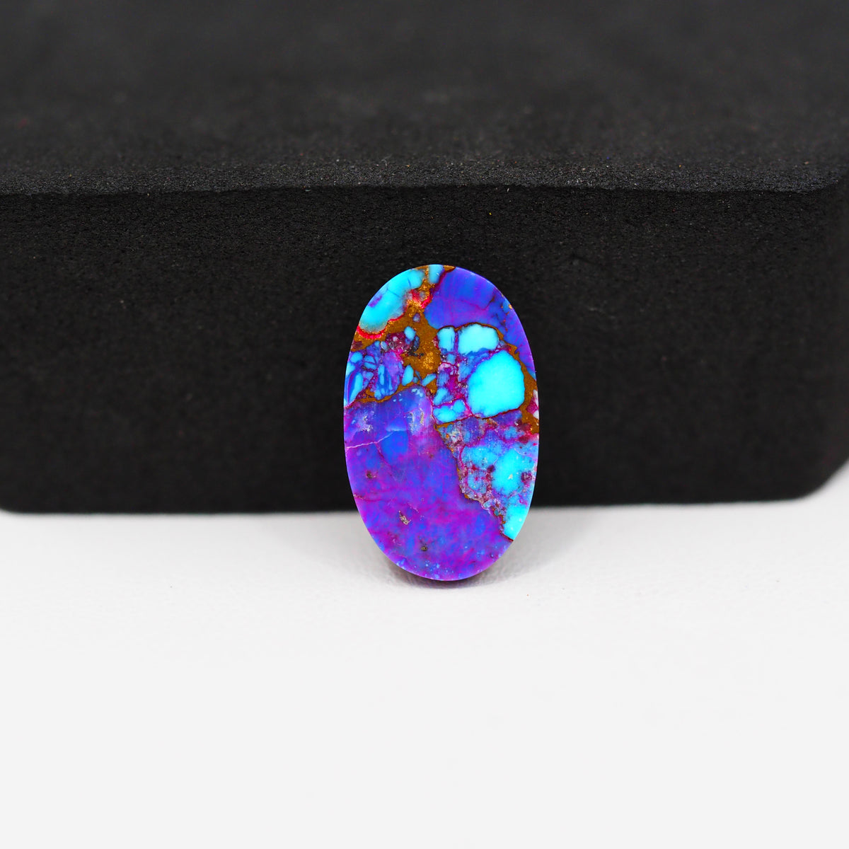 Stabilized Purple Mohave (Mojave) Turquoise Oval Cabochon 17x11x3mm 5.5ct - purple with blue Kingman turquoise nuggets and bronze veining - Pedra Gems.