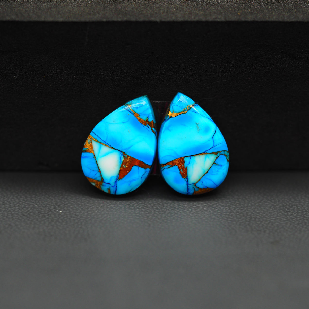Kingman Ice Blue Dahlia Pear Cabochon Pair 17x12x3mm 12.5ct - icy blue and white stone with copper veining - Pedra Gems