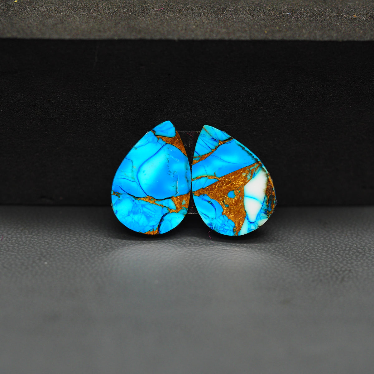 Kingman Ice Blue Dahlia Pear Cabochon Pair 17x12x3mm 12.5ct - icy blue and white stone with copper veining - Pedra Gems