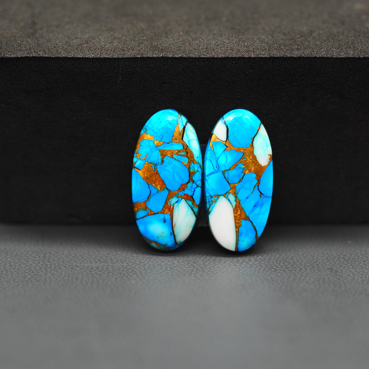 Kingman Ice Blue Dahlia Oval Cabochon Pair 21x11x3mm 15.5ct - icy blue and white stone with copper veining - Pedra Gems