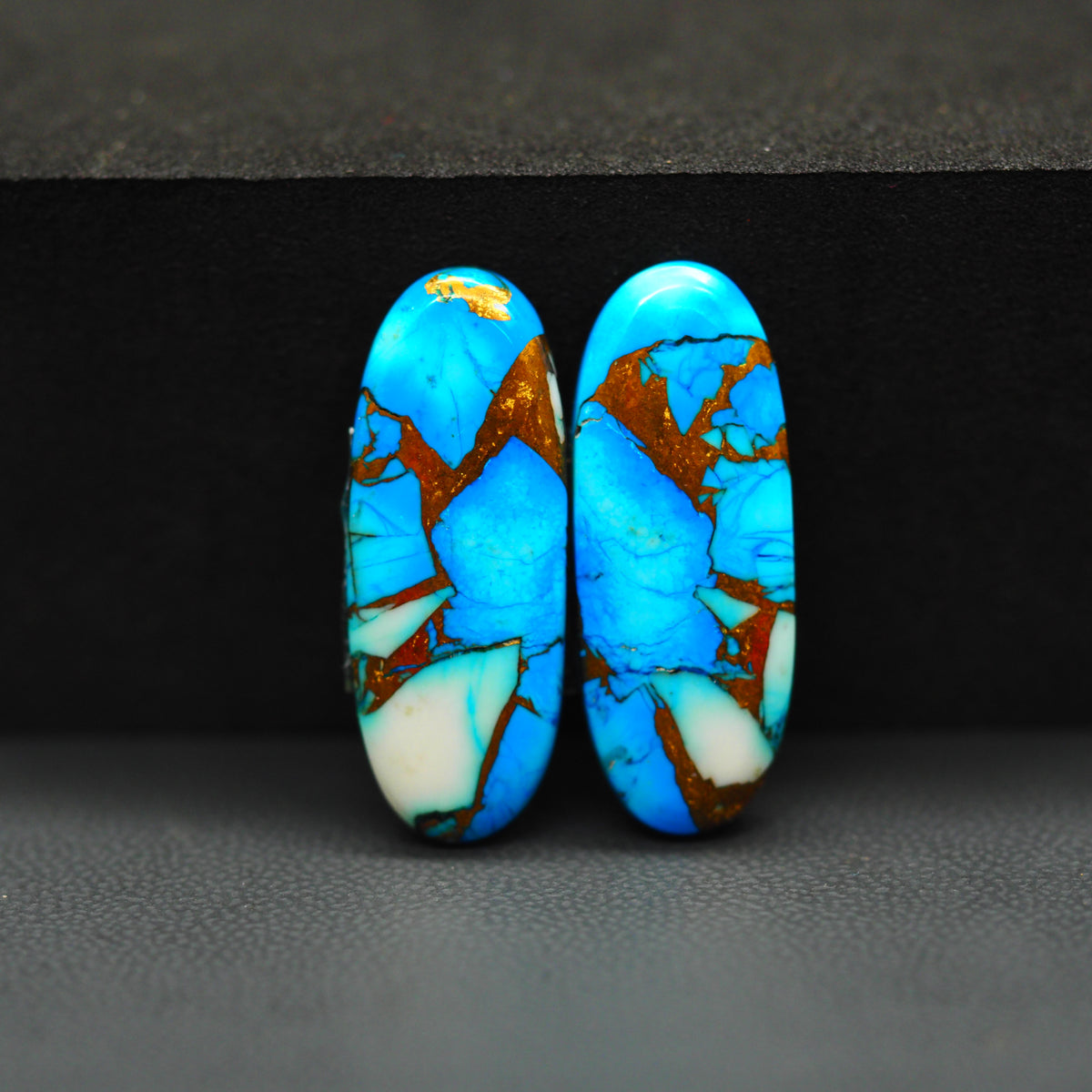 Kingman Ice Blue Dahlia Composite Oval Cabochon Pair 27x10x3mm 18.5ct - icy blue and white stone with copper veining - Pedra Gems