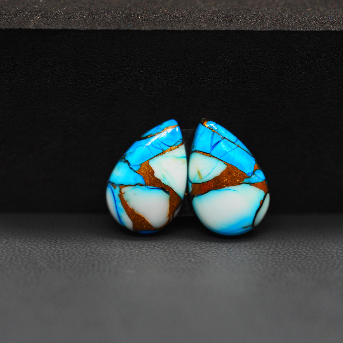 Kingman Ice Blue Dahlia Composite Pear Cabochon Pair 17x11x3mm 11.5ct - icy blue and white stone with copper veining - Pedra Gems