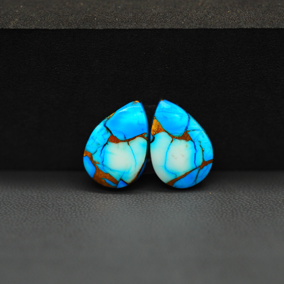 Kingman Ice Blue Dahlia Composite Pear Cabochon Pair 17x12x3mm 12.5ct - icy blue and white stone with copper veining - Pedra Gems