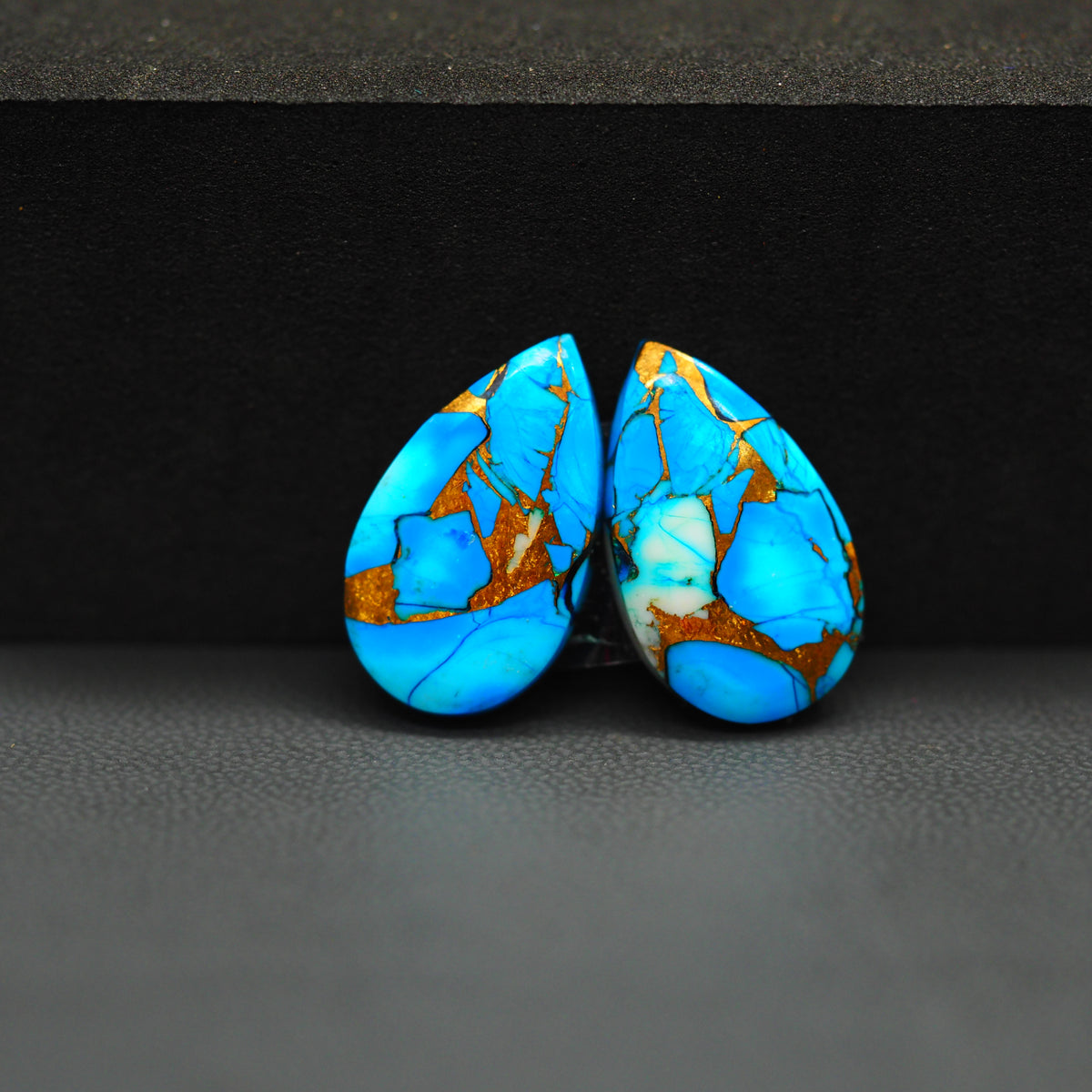 Kingman Ice Blue Dahlia Composite Pear Cabochon Pair 19x12x3mm 15ct - icy blue and white stone with copper veining - Pedra Gems