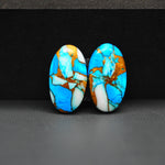 Kingman Ice Blue Dahlia Composite Oval Cabochon Pair 20x11x3mm 14ct - icy blue and white stone with copper veining - Pedra Gems