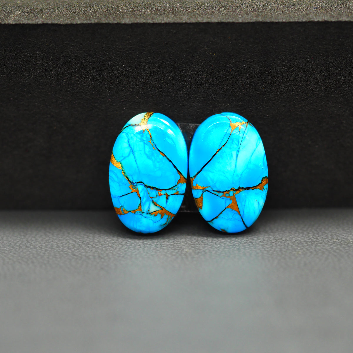Kingman Ice Blue Dahlia Composite Oval Cabochon Pair 17x11x3mm 13ct - icy blue and white stone with copper veining - Pedra Gems