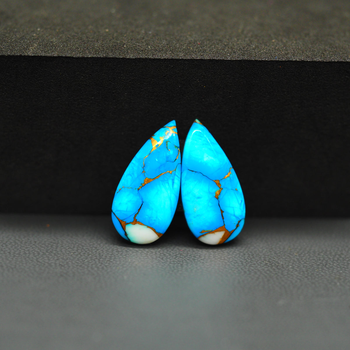 Kingman Ice Blue Dahlia Composite Pear Cabochon Pair 20x10x3mm 12ct - icy blue and white stone with copper veining - Pedra Gems