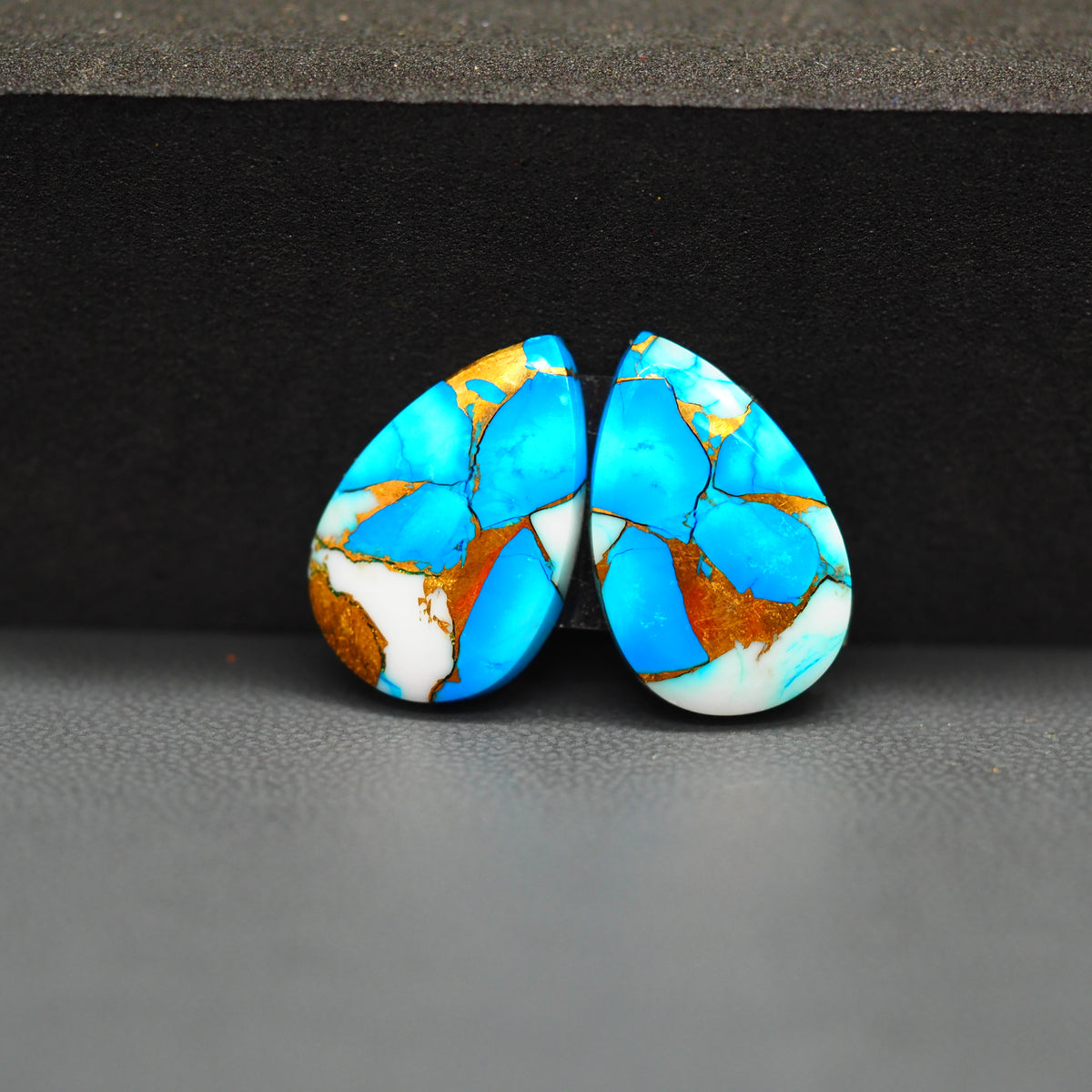 Kingman Ice Blue Dahlia Composite Pear Cabochon Pair 19x12x3mm 15ct - icy blue and white stone with copper veining - Pedra Gems
