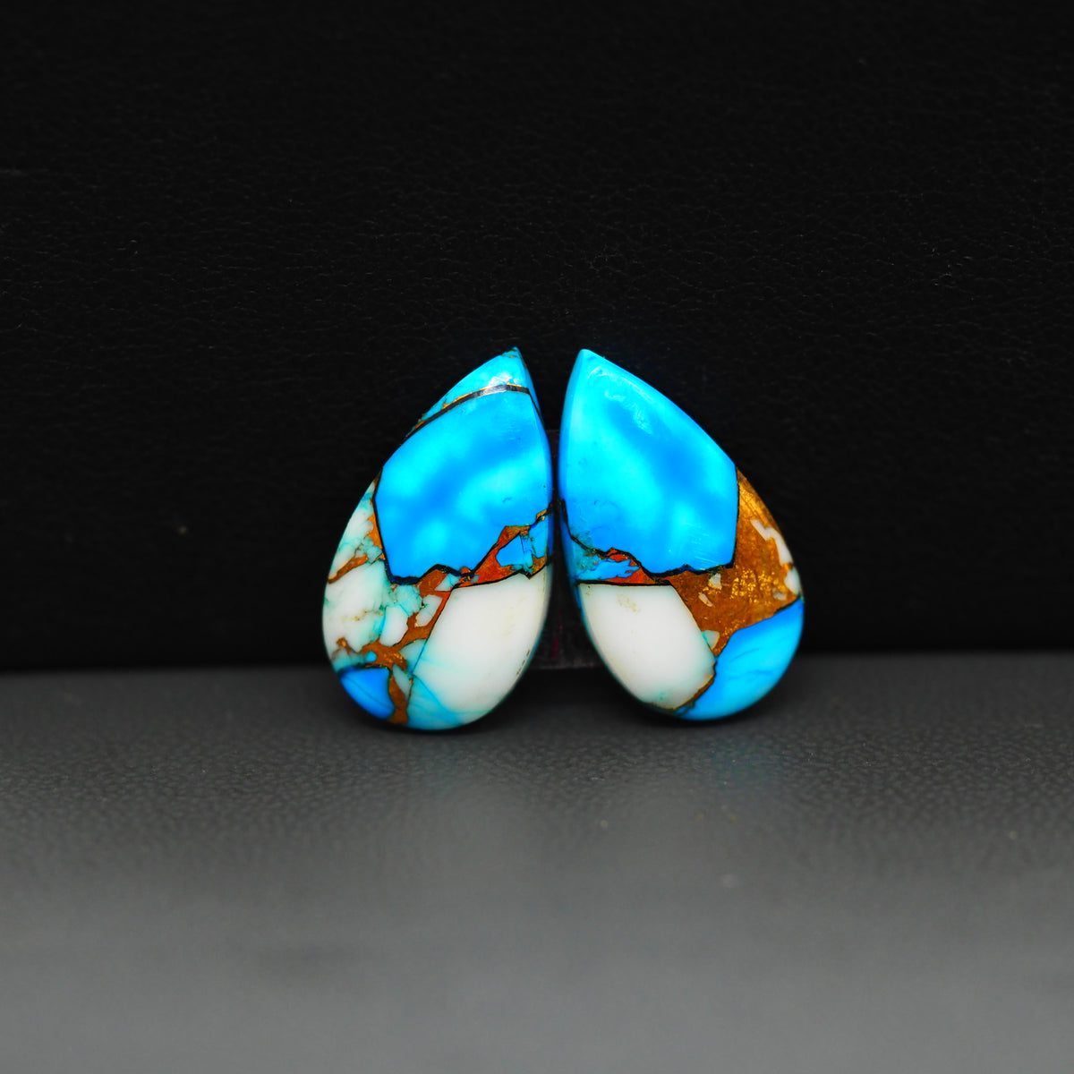 Kingman Ice Blue Dahlia Composite Pear Cabochon Pair 19x11x3mm 13ct - icy blue and white stone with copper veining - Pedra Gems