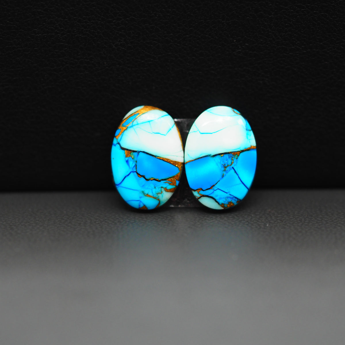 Kingman Ice Blue Dahlia Composite Oval Cabochon Pair 14x10x3mm 9.5ct - icy blue and white stone with copper veining - Pedra Gems
