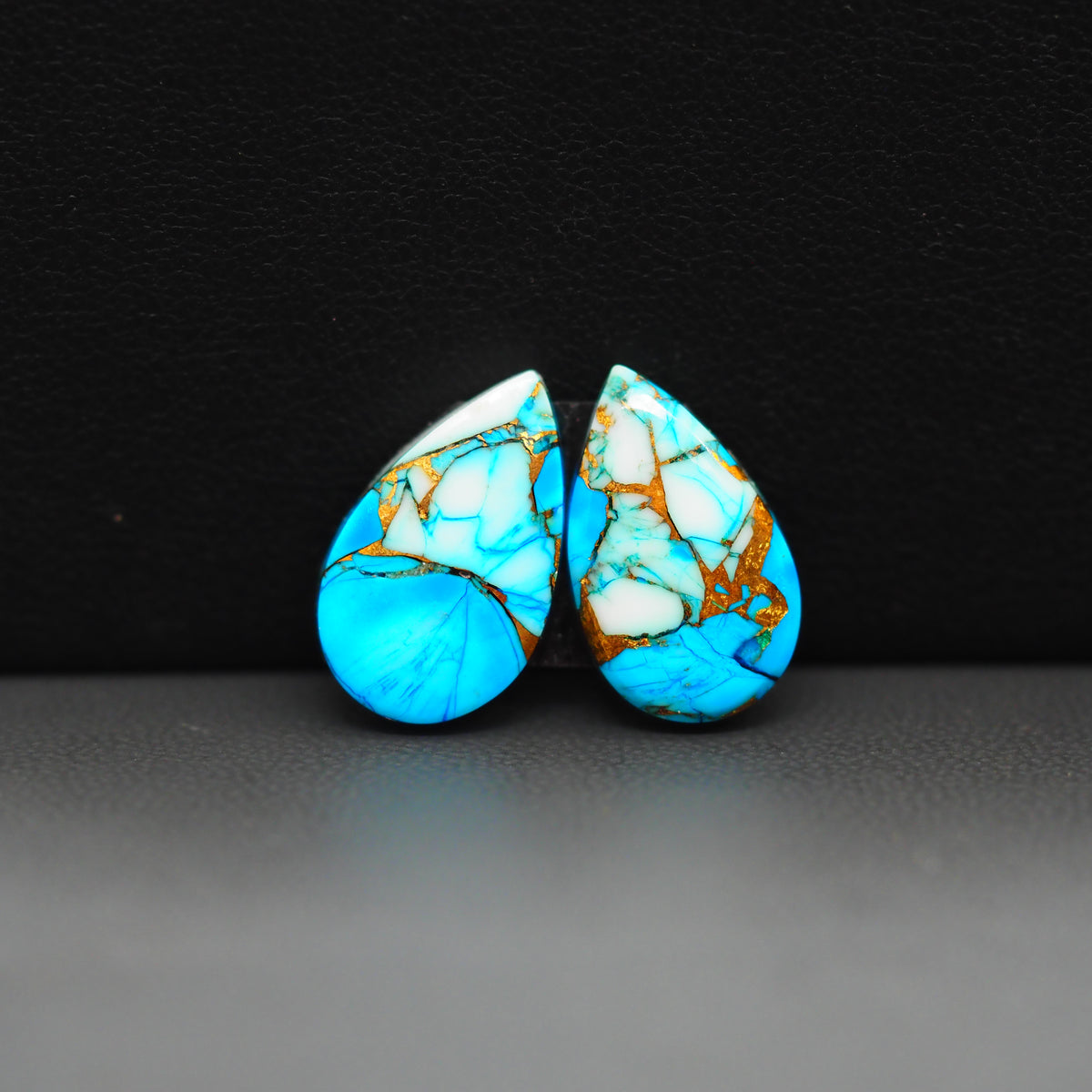Kingman Ice Blue Dahlia Composite Pear Cabochon Pair 17x10x3mm 11ct - icy blue and white stone with copper veining - Pedra Gems