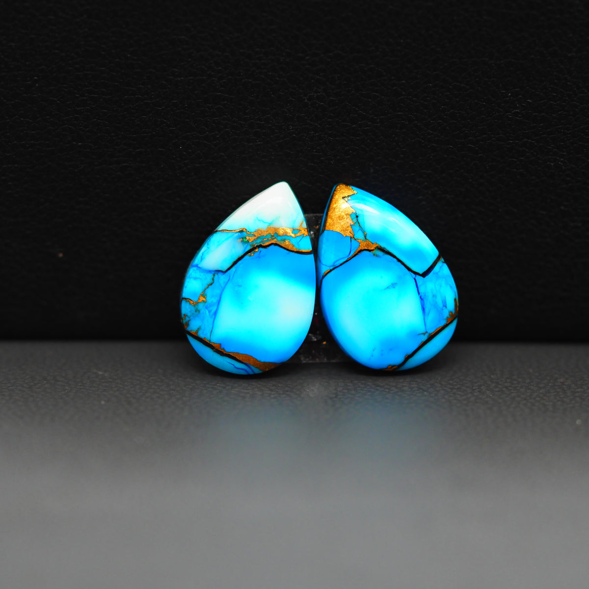 Kingman Ice Blue Dahlia Composite Pear Cabochon Pair 15x11x3mm 11ct - icy blue and white stone with copper veining - Pedra Gems