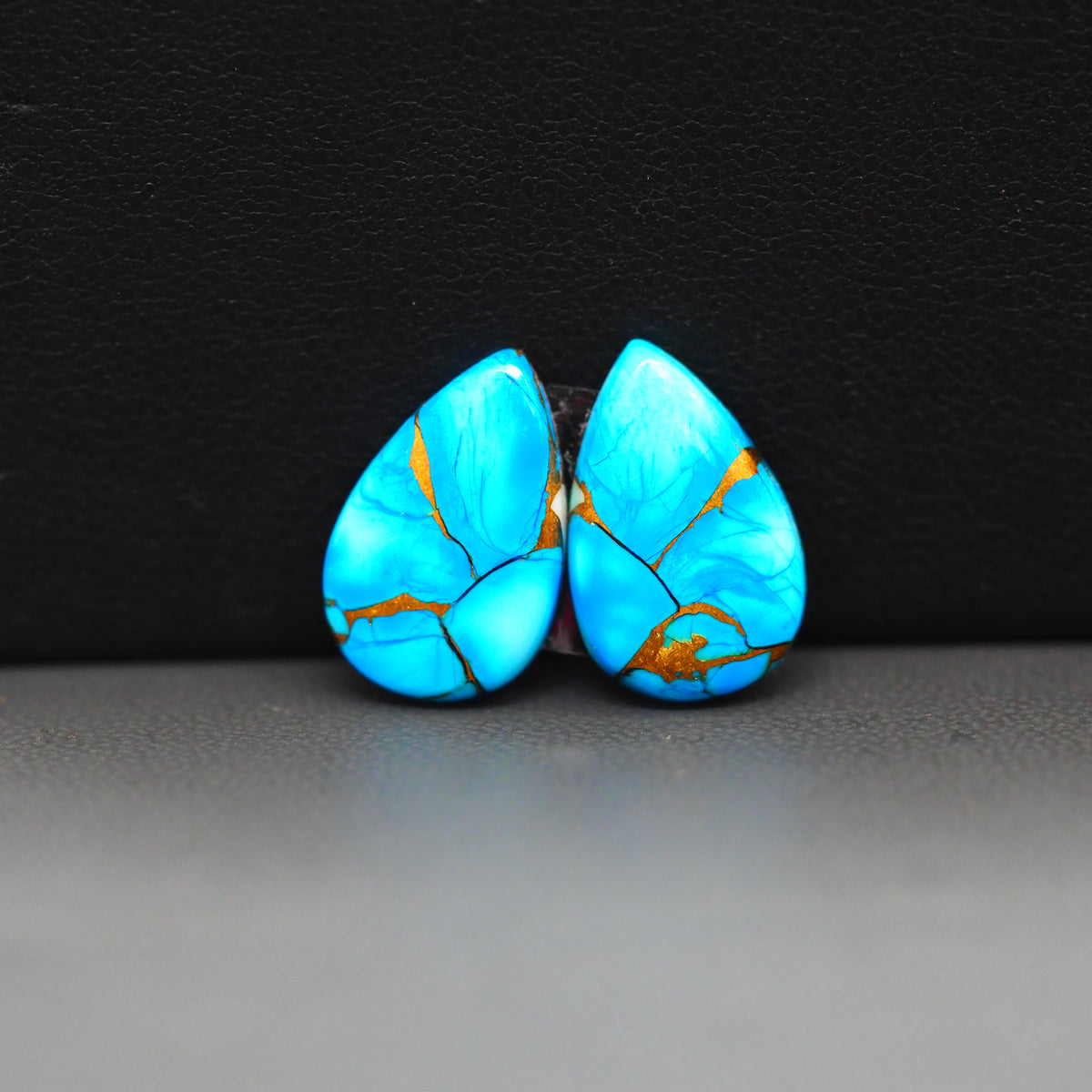Kingman Ice Blue Dahlia Composite Pear Cabochon Pair 17x11x3mm 10ct - icy blue and white stone with copper veining - Pedra Gems