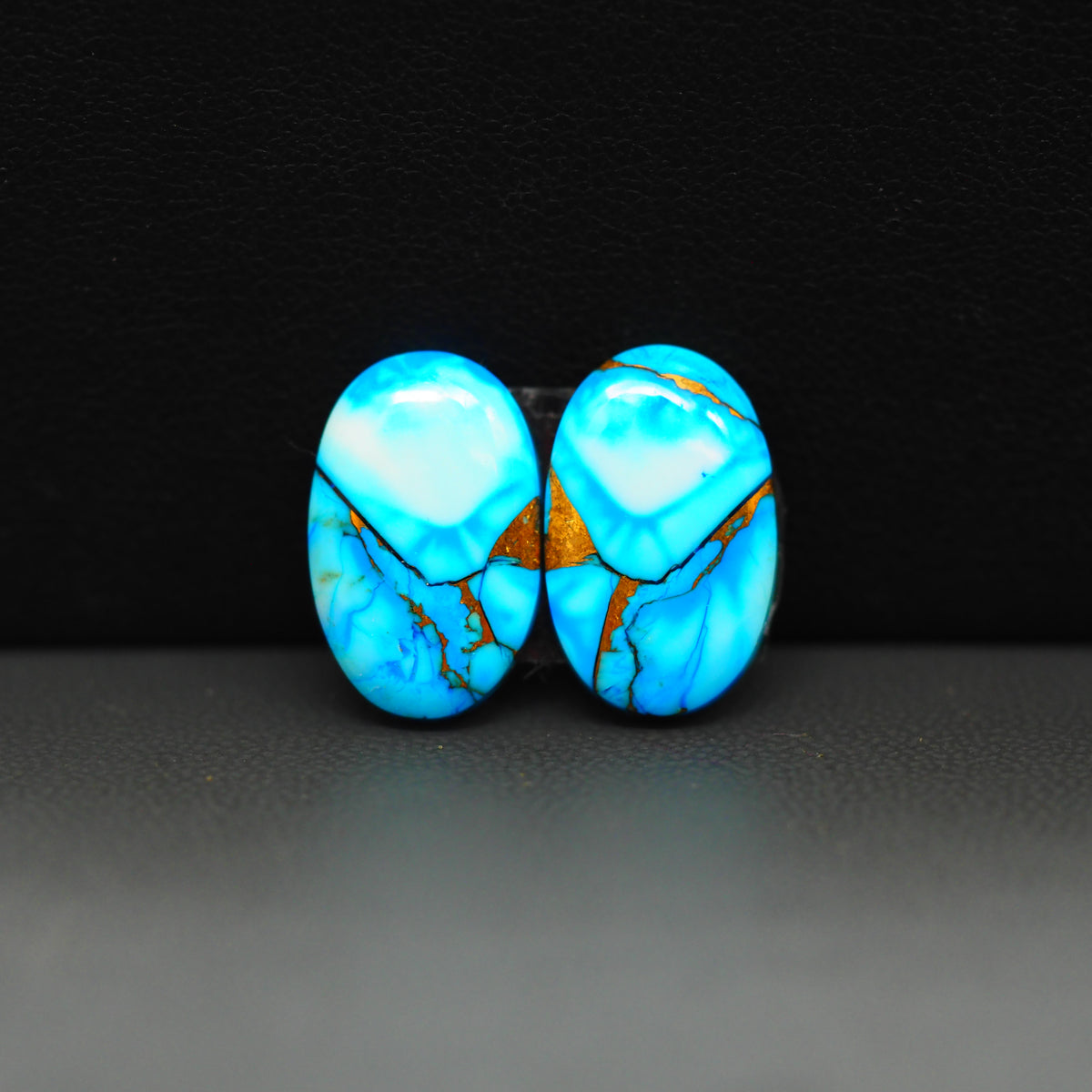 Kingman Ice Blue Dahlia Composite Oval Cabochon Pair 16x11x3mm 12ct - icy blue and white stone with copper veining - Pedra Gems