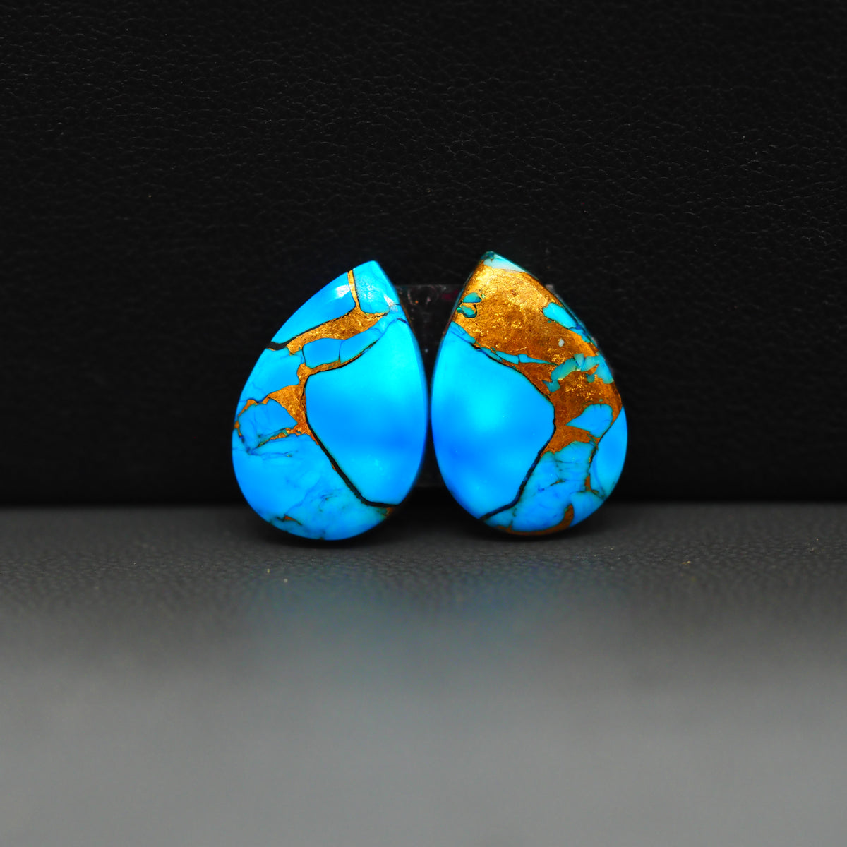 Kingman Ice Blue Dahlia Composite Pear Cabochon Pair 17x11x3mm 12ct - icy blue and white stone with copper veining - Pedra Gems