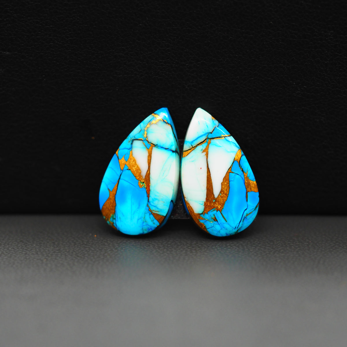 Kingman Ice Blue Dahlia Composite Pear Cabochon Pair 21x12x3mm 15.5ct - icy blue and white stone with copper veining - Pedra Gems
