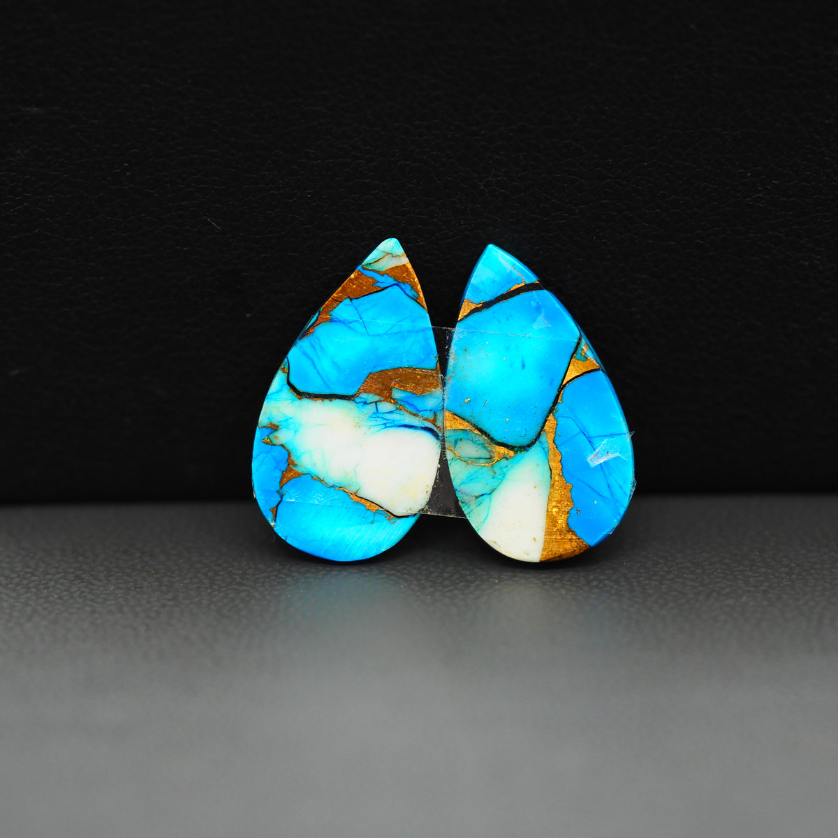 Kingman Ice Blue Dahlia Composite Pear Cabochon Pair 20x11x3mm 14.5ct - icy blue and white stone with copper veining - Pedra Gems