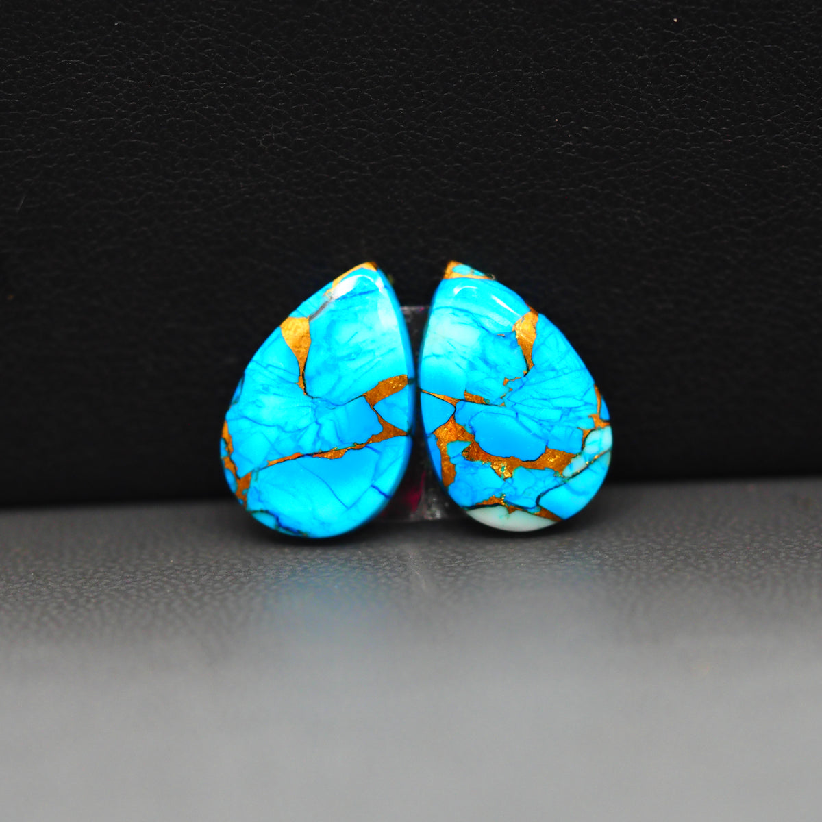 Kingman Ice Blue Dahlia Composite Pear Cabochon Pair 14x10x3mm 10ct - icy blue and white stone with copper veining - Pedra Gems