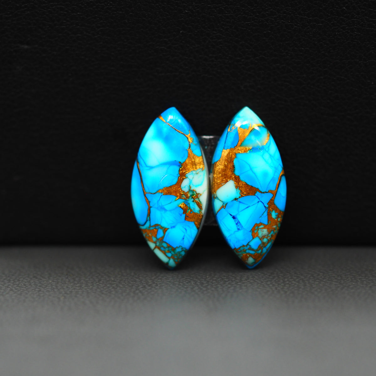 Kingman Ice Blue Dahlia Composite Marquise Cabochon Pair 21x10x3mm 13ct - icy blue and white stone with copper veining - Pedra Gems