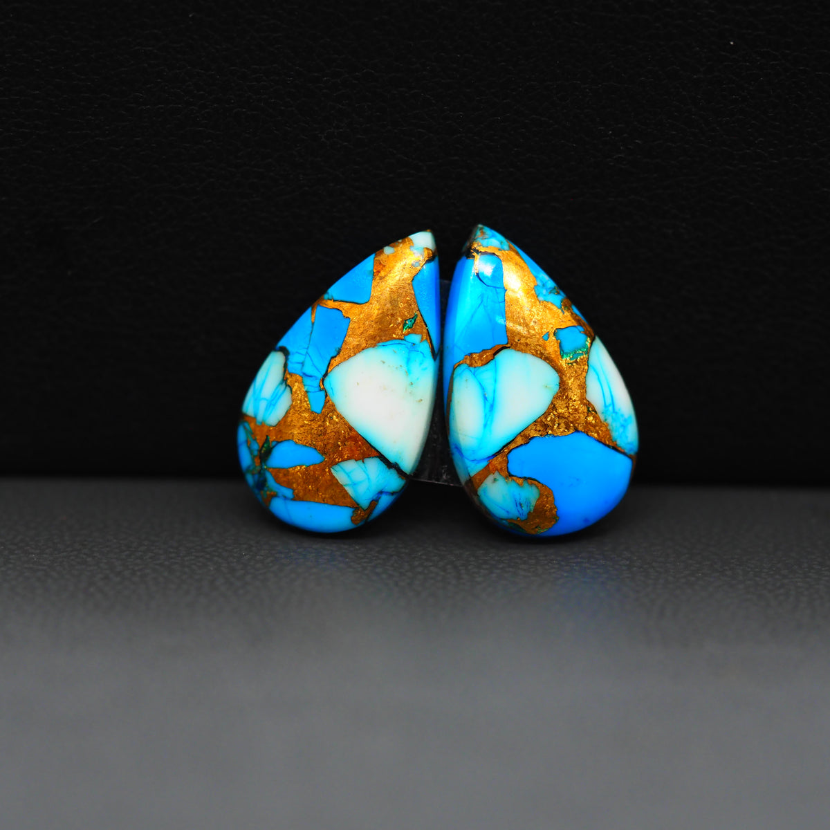 Kingman Ice Blue Dahlia Composite Pear Cabochon Pair 19x11x3mm 12ct - icy blue and white stone with copper veining - Pedra Gems