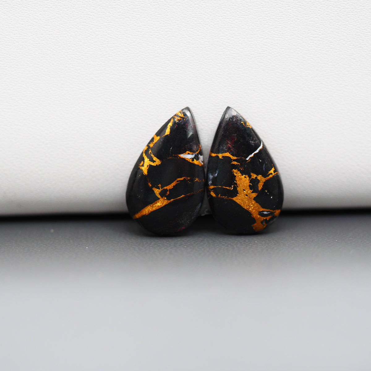 Kingman Black Buffalo Copper Composite Pear Cabochon Pair 19x11x3mm 10.5ct - black stone with bright copper veins - Pedra Gems
