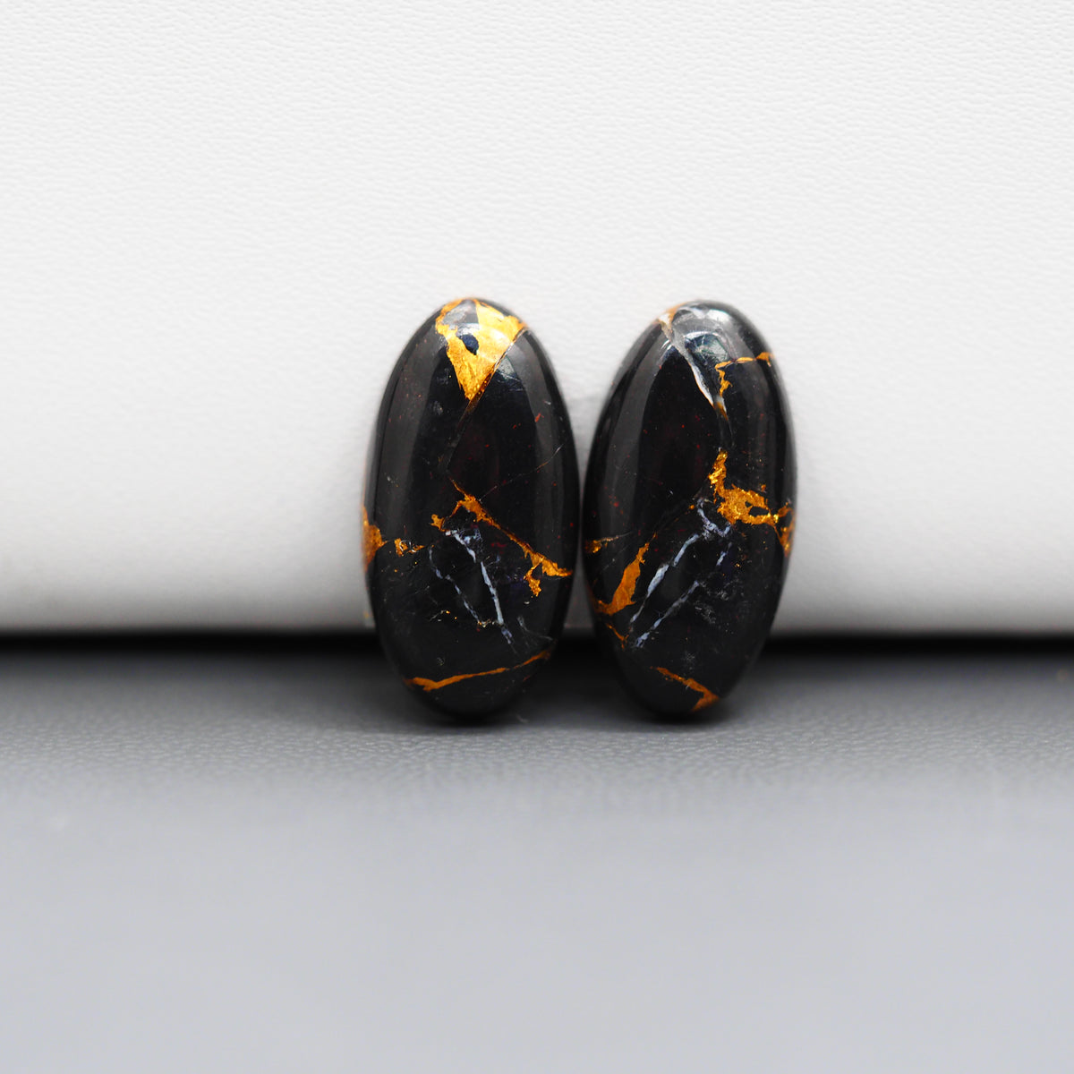 Kingman Black Buffalo Copper Composite Oval Cabochon Pair 19x10x3mm 13.5ct - black stone with bright copper veins - Pedra Gems