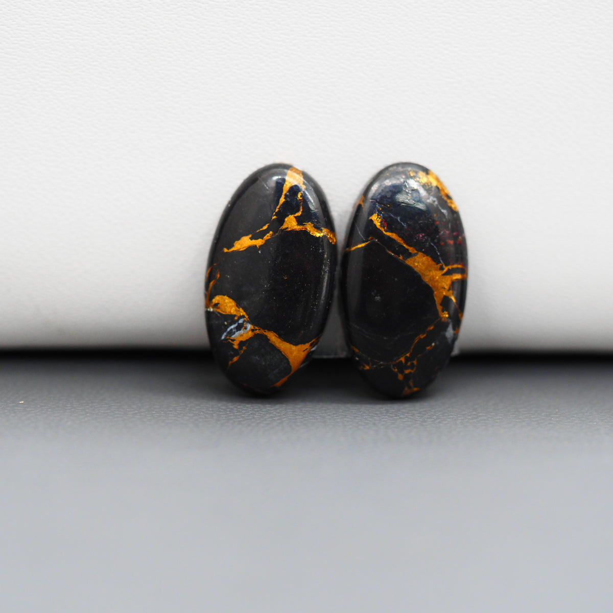 Kingman Black Buffalo Copper Composite Oval Cabochon Pair 19x11x3mm 13.5ct - black stone with bright copper veins - Pedra Gems