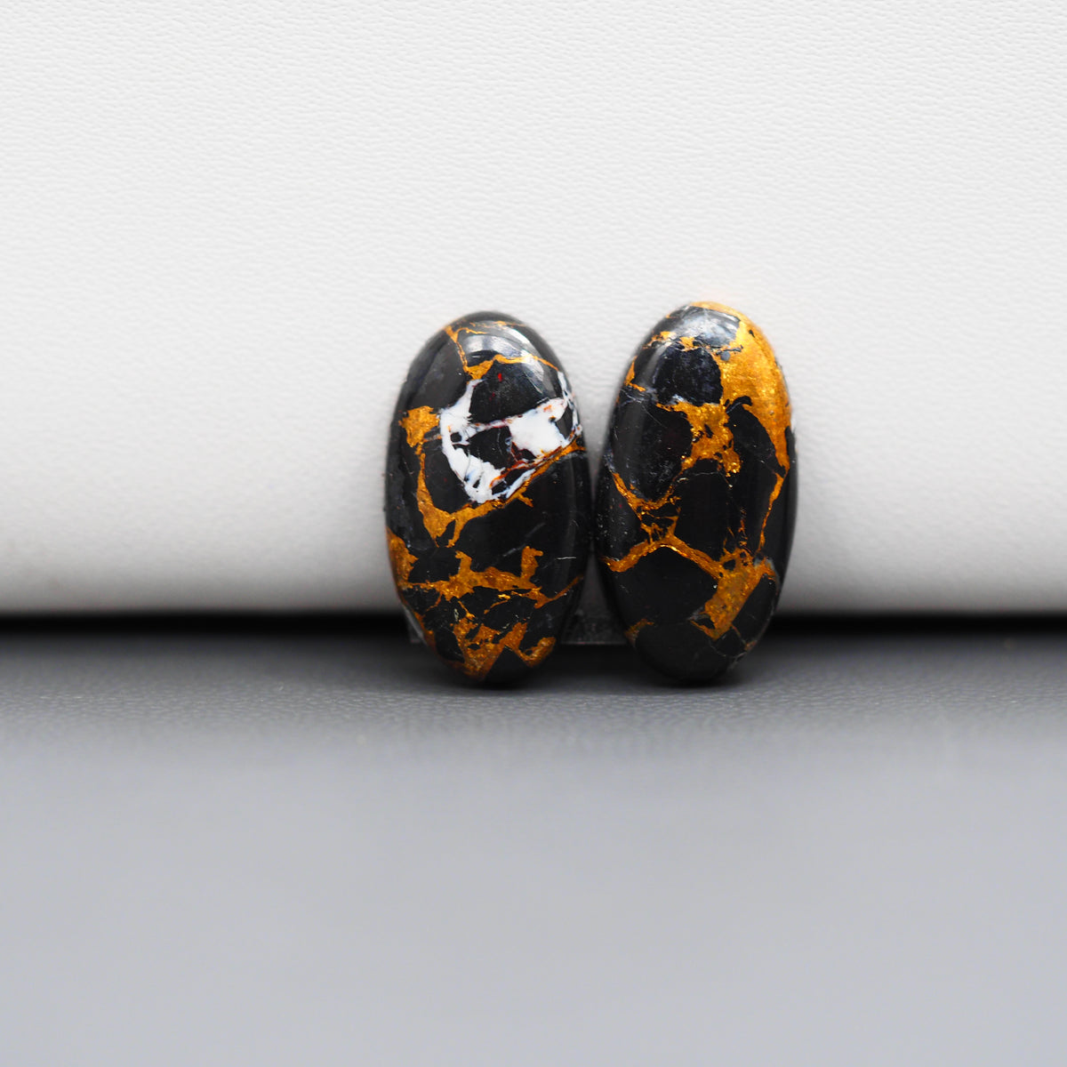 Kingman Black Buffalo Copper Composite Oval Cabochon Pair 19x10x4mm 13ct - black stone with bright copper veins - Pedra Gems