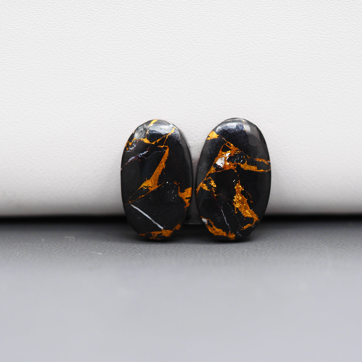 Kingman Black Buffalo Copper Composite Oval Cabochon Pair 17x11x3mm 12ct - black stone with bright copper veins - Pedra Gems