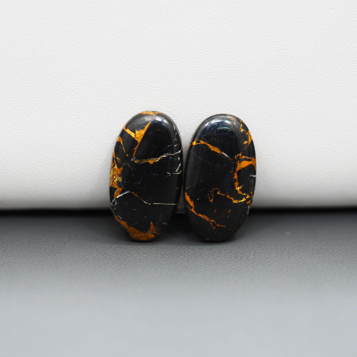 Kingman Black Buffalo Copper Composite Oval Cabochon Pair 20x11x3mm 12.5ct - black stone with bright copper veins - Pedra Gems