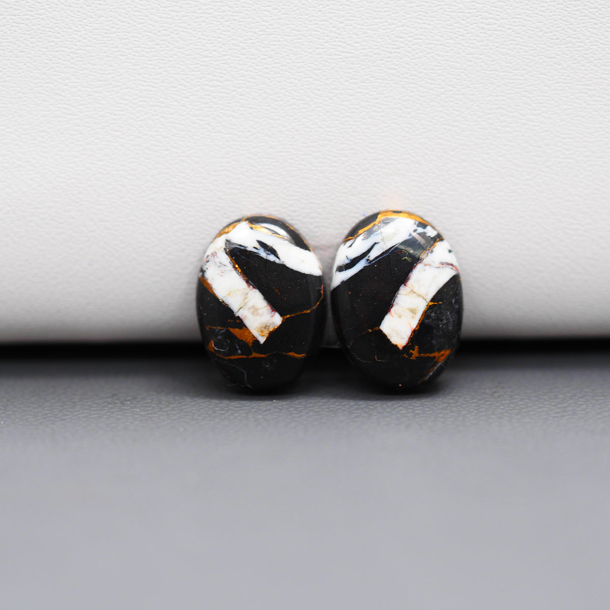 Kingman Black Buffalo Copper Composite Oval Cabochon Pair 14x11x4mm 10ct - black stone with bright copper veins - Pedra Gems
