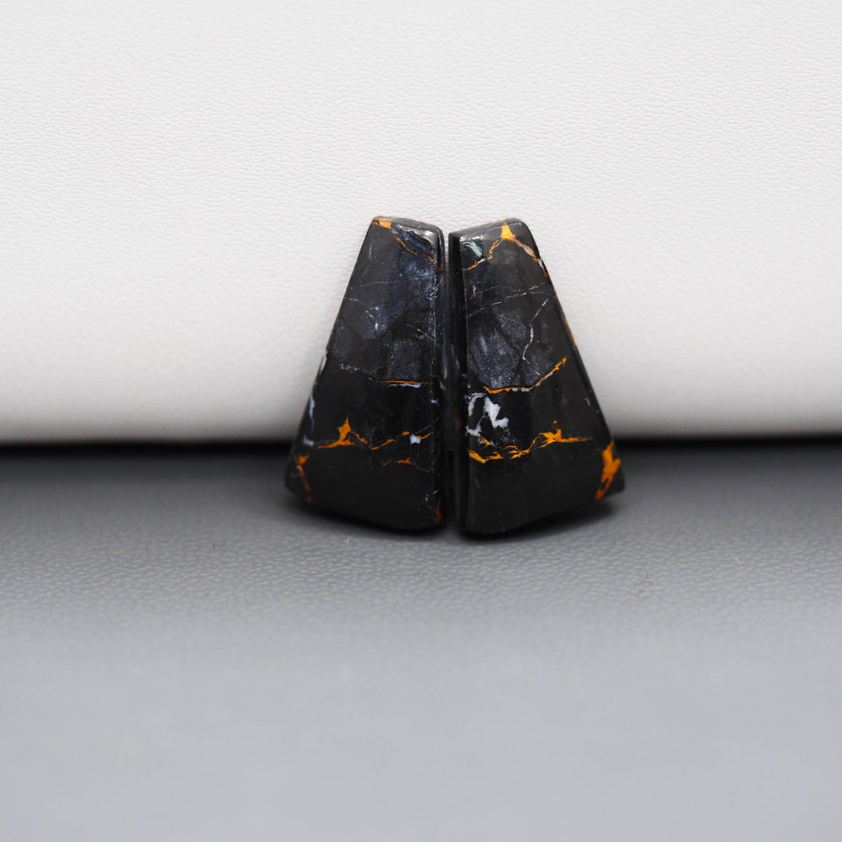 Kingman Black Buffalo Copper Composite Trapezoid Cabochon Pair 21x12x3mm 15ct - black stone with bright copper veins - Pedra Gems