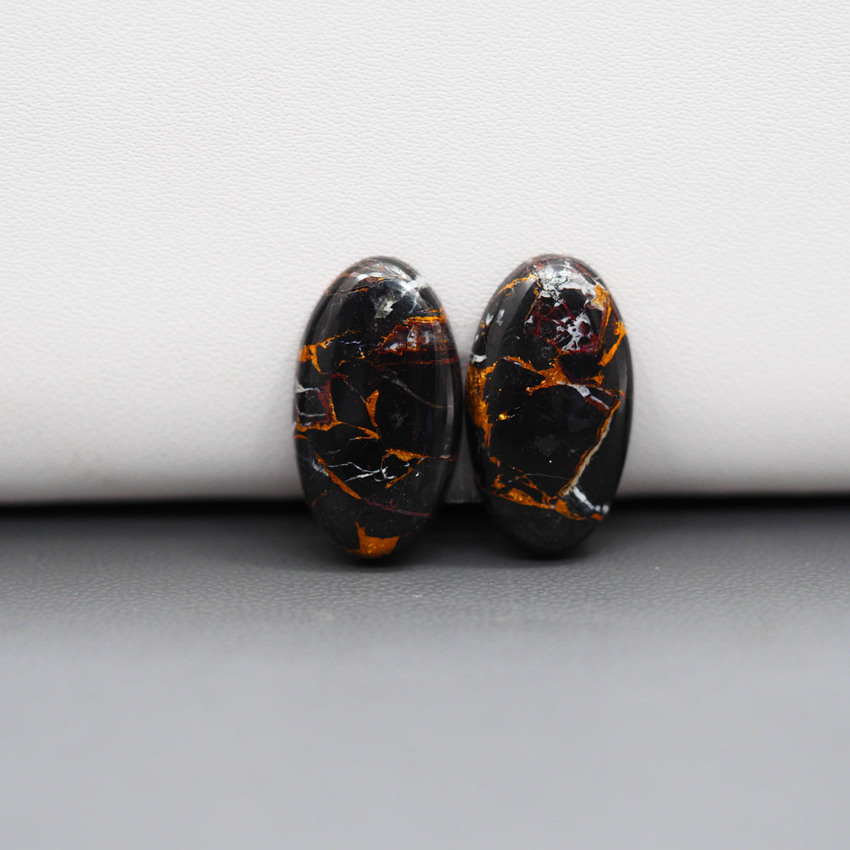 Kingman Black Buffalo Copper Composite Oval Cabochon Pair 20x11x3mm 14ct - black stone with bright copper veins - Pedra Gems