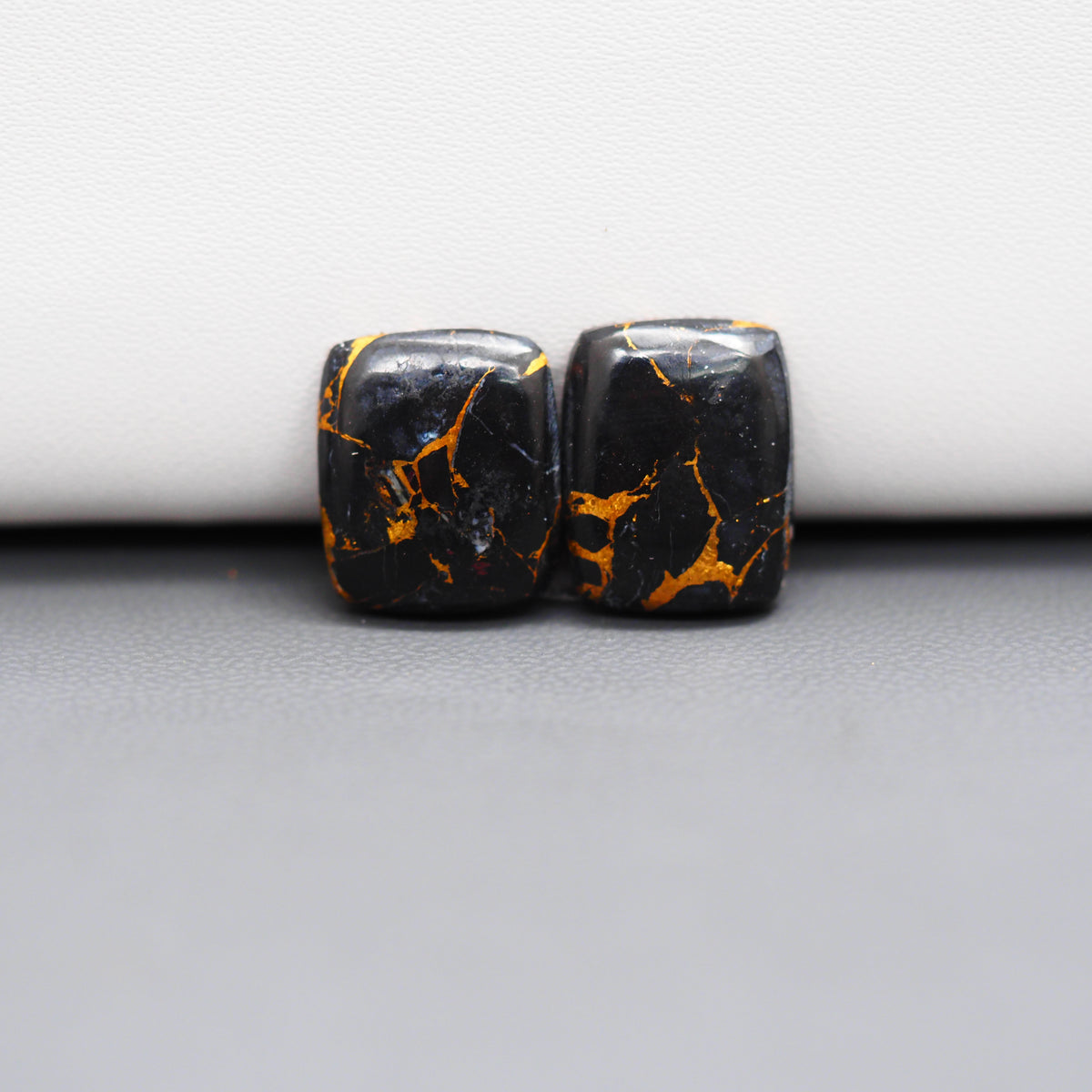 Kingman Black Buffalo Copper Composite Cushion Cabochon Pair 15x12x3mm 11.5ct - black stone with bright copper veins - Pedra Gems