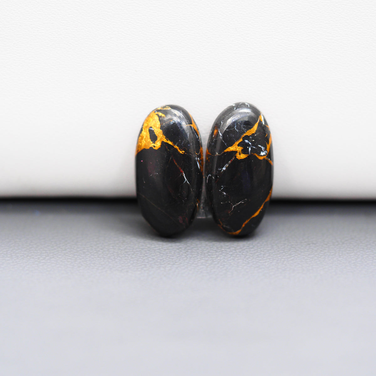 Kingman Black Buffalo Copper Composite Oval Cabochon Pair 20x10x3mm 13ct - black stone with bright copper veins - Pedra Gems