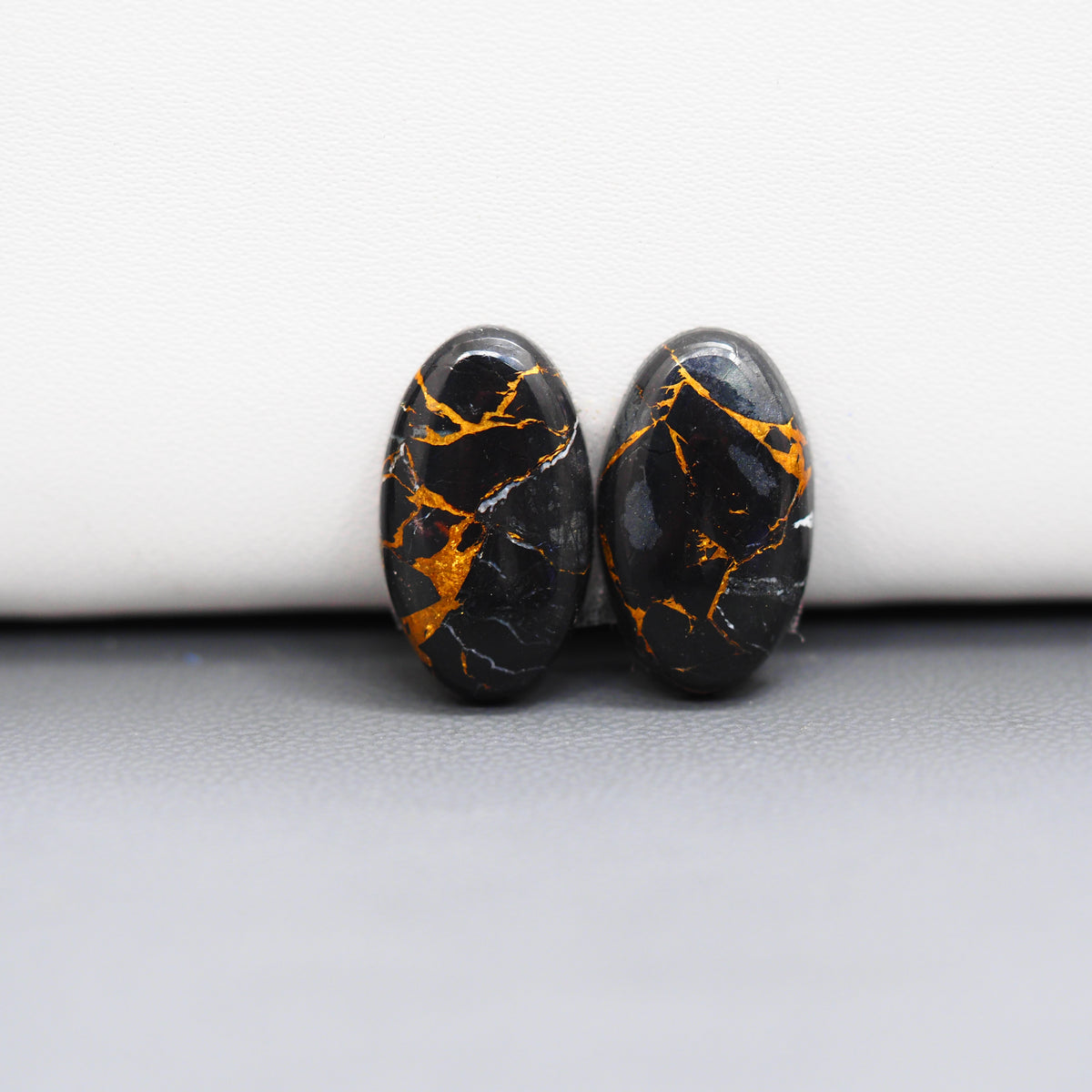 Kingman Black Buffalo Copper Composite Oval Cabochon Pair 18x11x3mm 12ct - black stone with bright copper veins - Pedra Gems