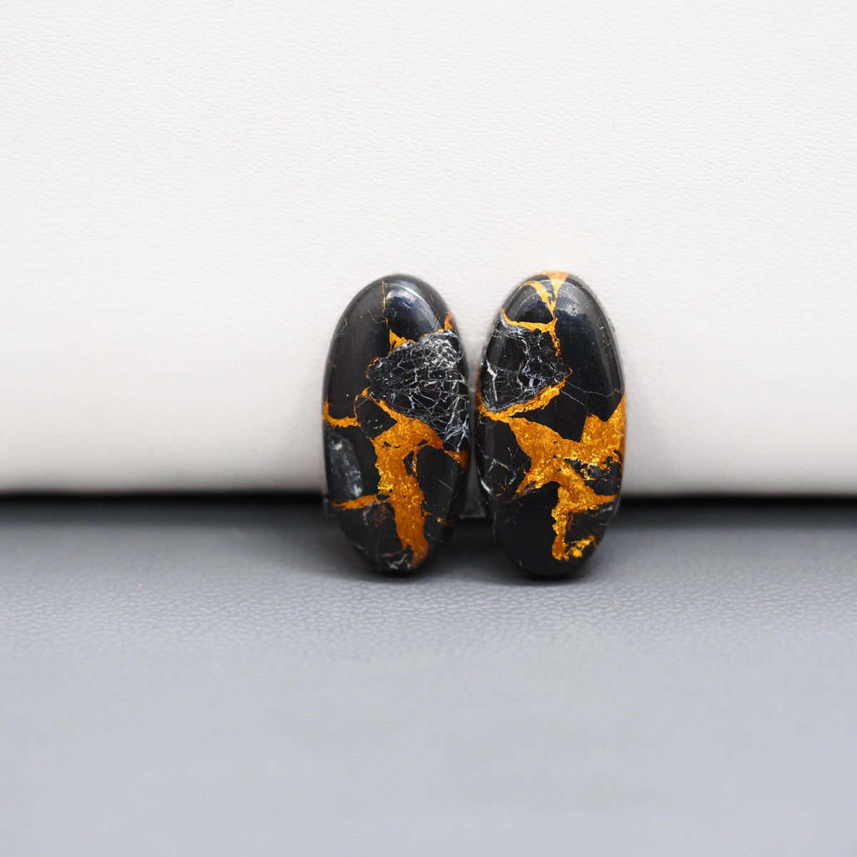 Kingman Black Buffalo Copper Composite Oval Cabochon Pair 20x10x3mm 14ct - black stone with bright copper veins - Pedra Gems