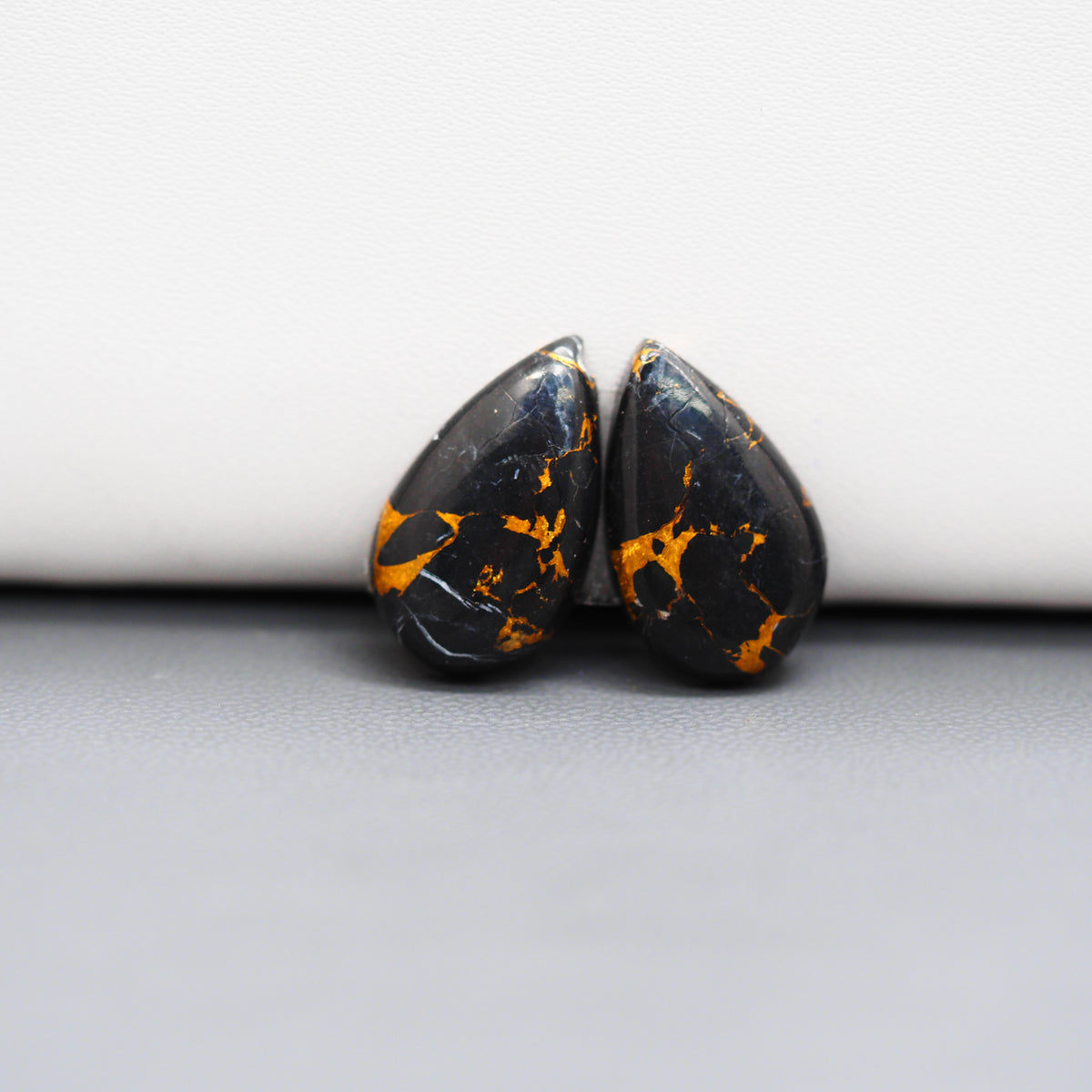 Kingman Black Buffalo Copper Composite Pear Cabochon Pair 19x11x3mm 13ct - black stone with bright copper veins - Pedra Gems