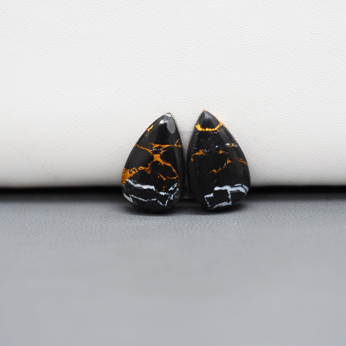 Kingman Black Buffalo Copper Composite Pear Cabochon Pair 17x10x3mm 8ct - black stone with bright copper veins - Pedra Gems