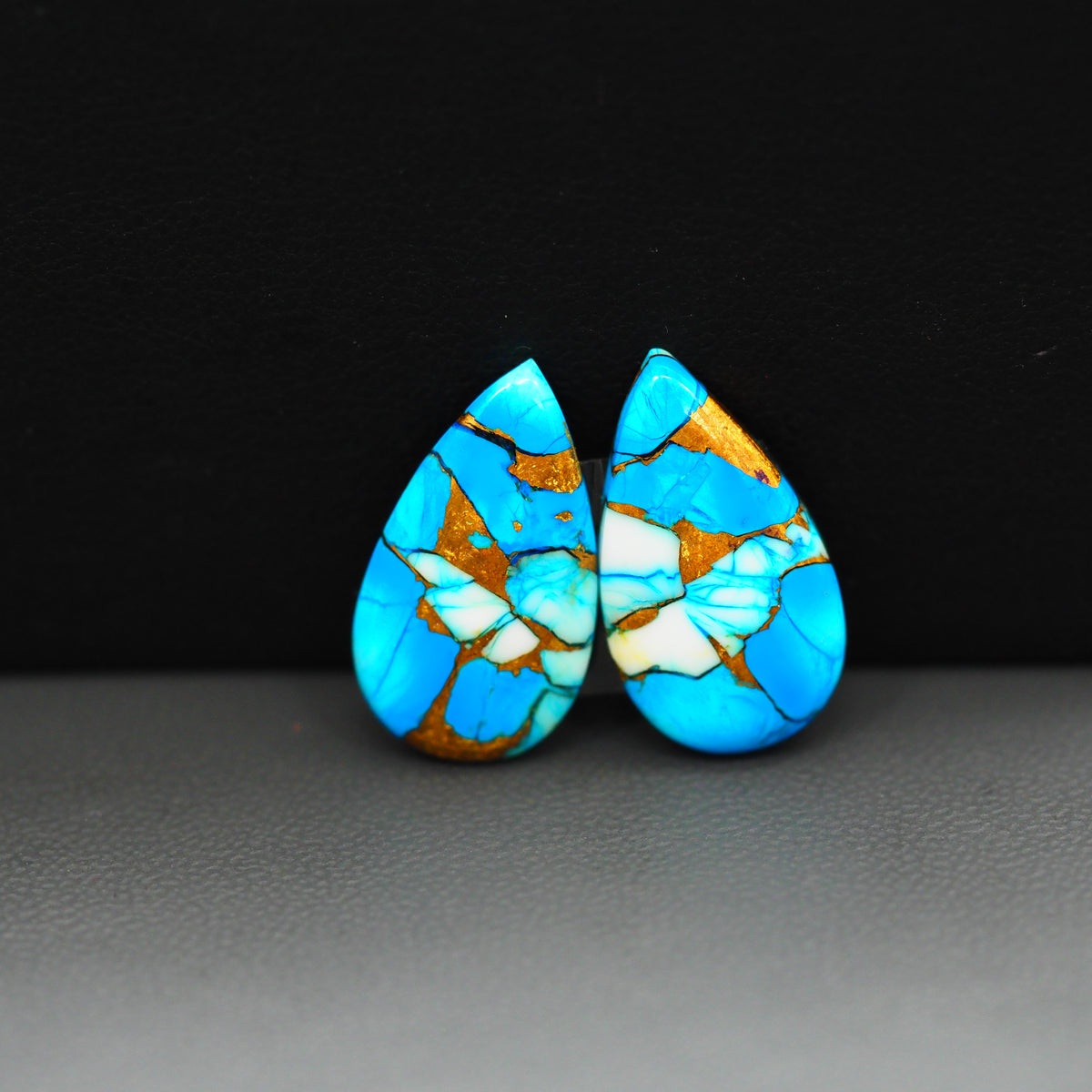 Kingman Ice Blue Dahlia Composite Pear Cabochon Pair 20x11x3mm 14.5ct - icy blue and white stone with copper veining - Pedra Gems