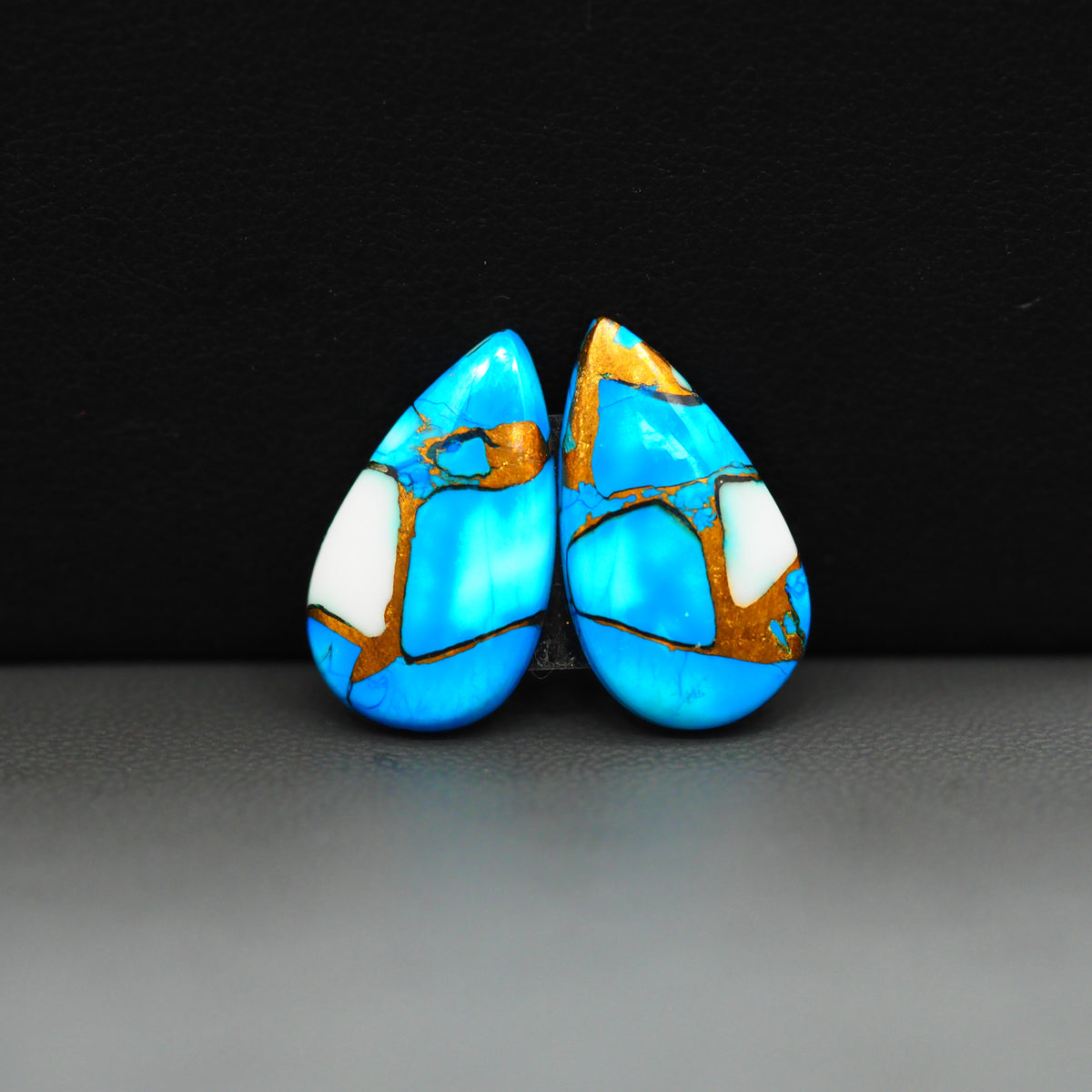 Kingman Ice Blue Dahlia Composite Pear Cabochon Pair 20x11x3mm 13ct - icy blue and white stone with copper veining - Pedra Gems