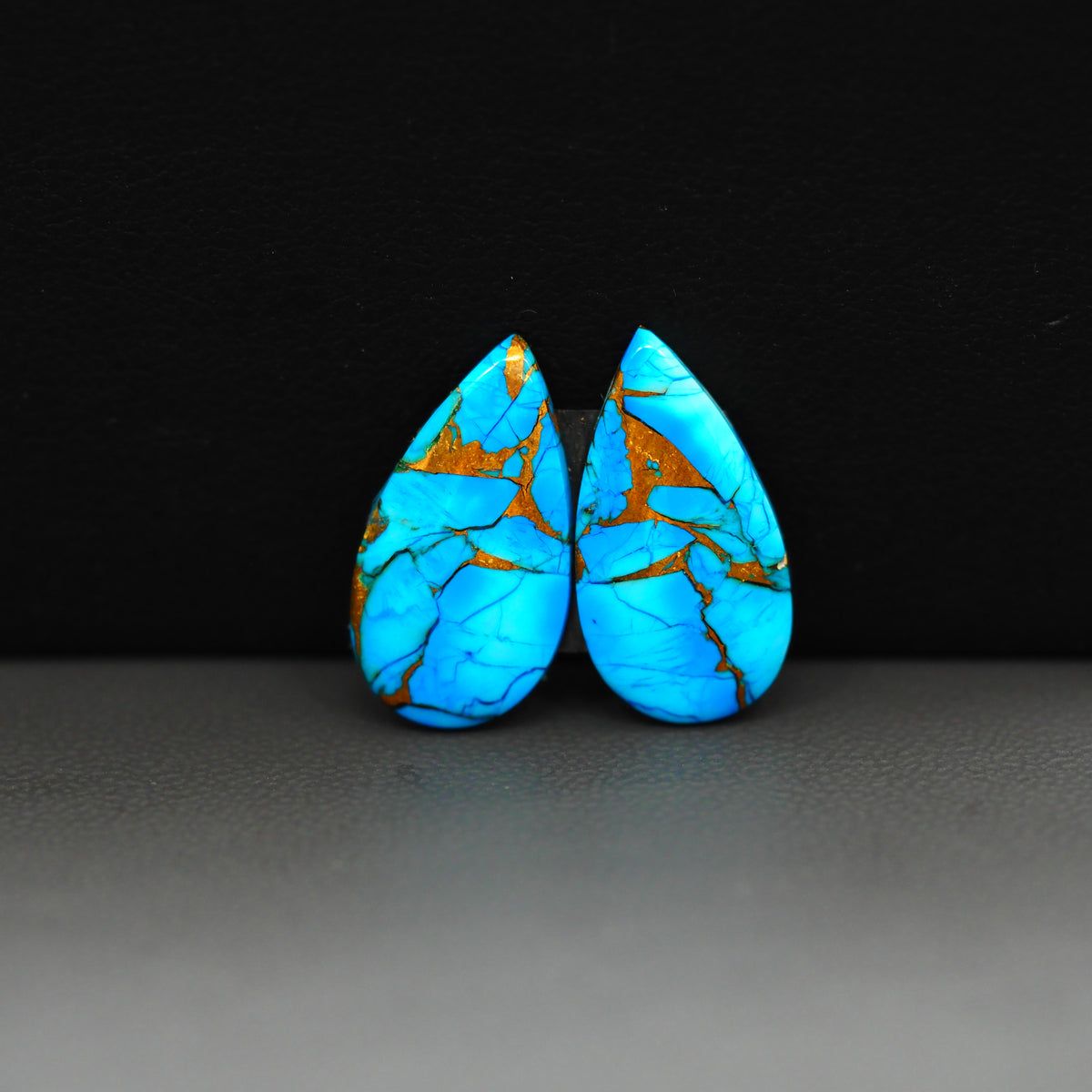 Kingman Ice Blue Dahlia Composite Pear Cabochon Pair 19x11x3mm 10ct - icy blue and white stone with copper veining - Pedra Gems