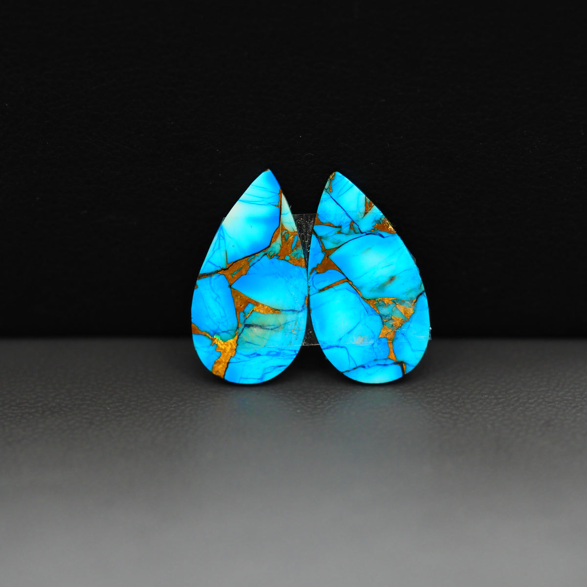 Kingman Ice Blue Dahlia Composite Pear Cabochon Pair 19x11x3mm 10ct - icy blue and white stone with copper veining - Pedra Gems
