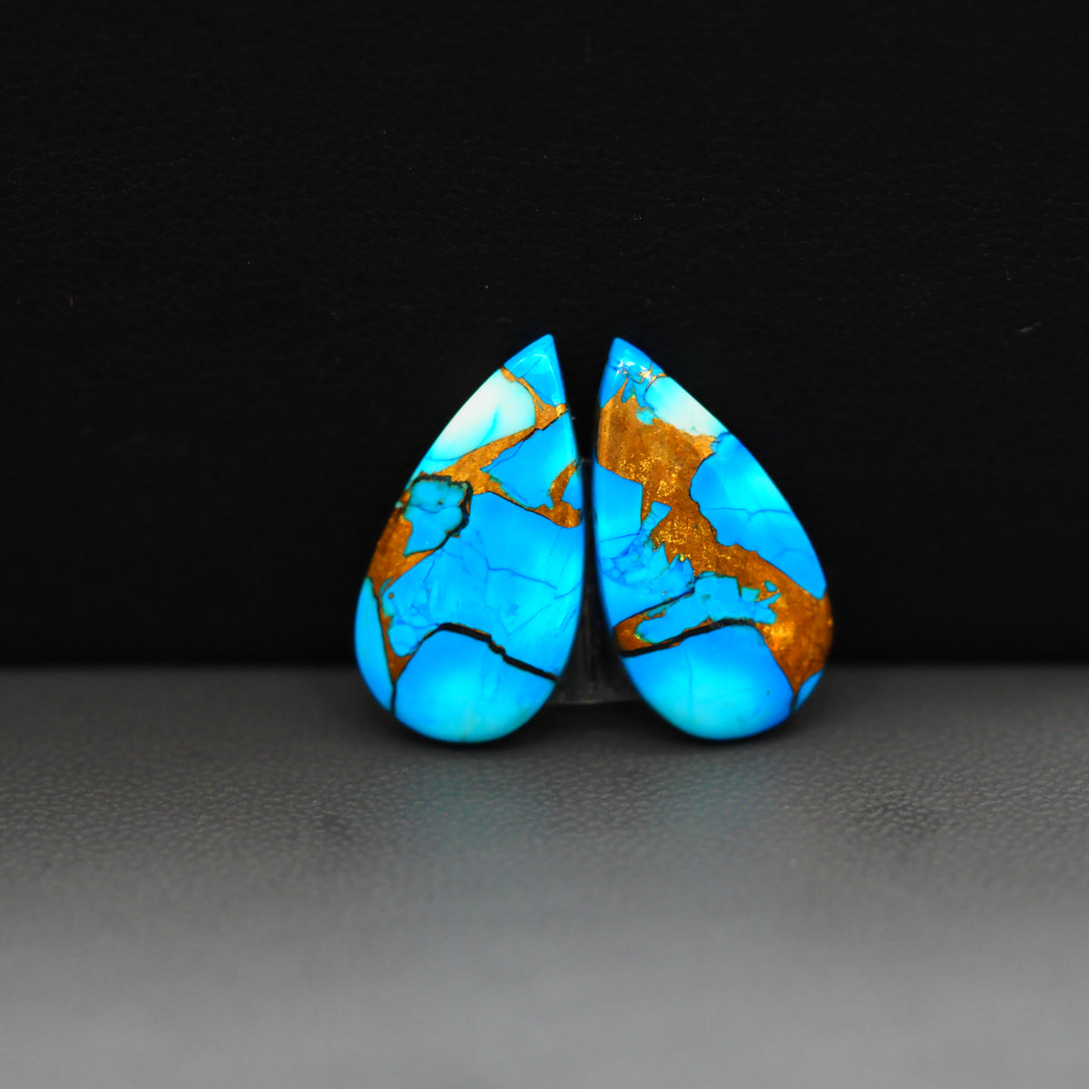 Kingman Ice Blue Dahlia Composite Pear Cabochon Pair 20x11x3mm 12.5ct - icy blue and white stone with copper veining - Pedra Gems