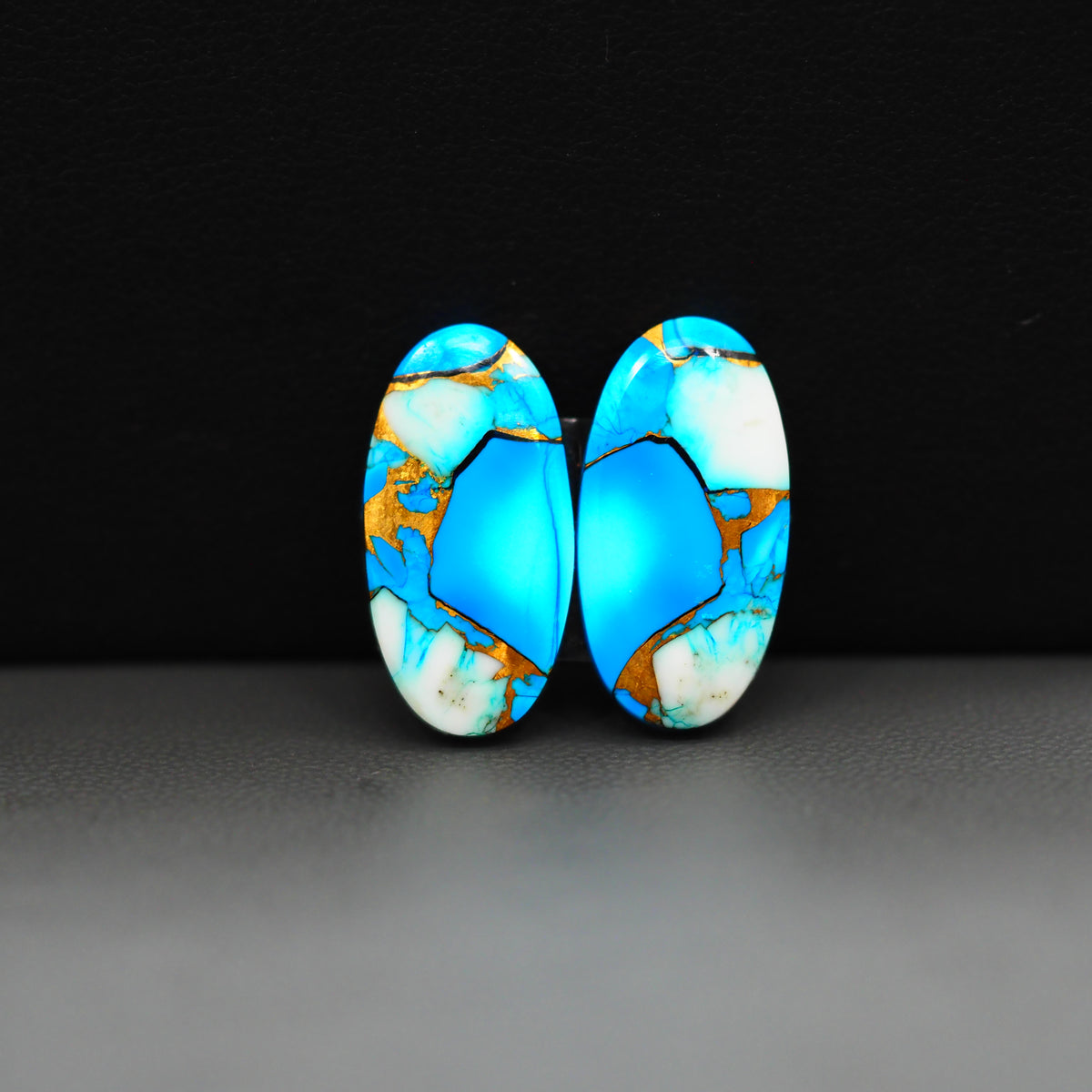 Kingman Ice Blue Dahlia Composite Oval Cabochon Pair 21x11x3mm 15ct - icy blue and white stone with copper veining - Pedra Gems