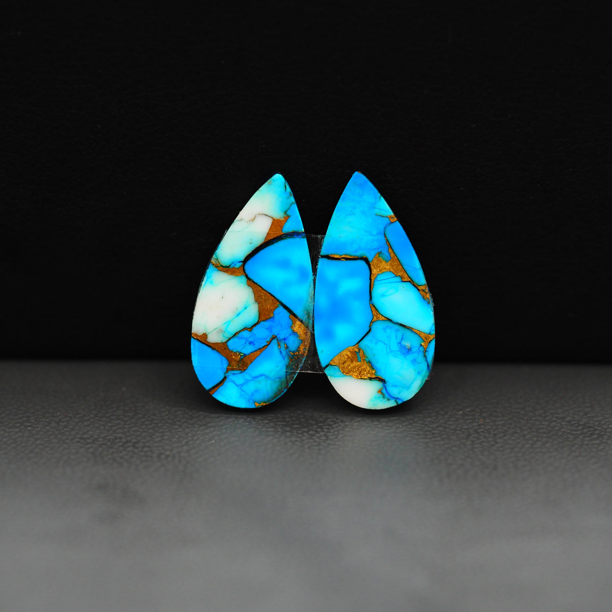 Kingman Ice Blue Dahlia Composite Pear Cabochon Pair 21x11x3mm 14ct - icy blue and white stone with copper veining - Pedra Gems