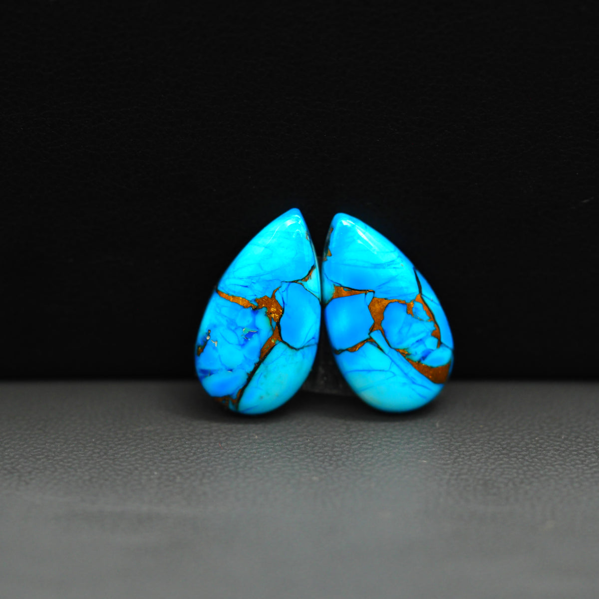 Kingman Ice Blue Dahlia Composite Pear Cabochon Pair 19x11x3mm 12ct - icy blue and white stone with copper veining - Pedra Gems