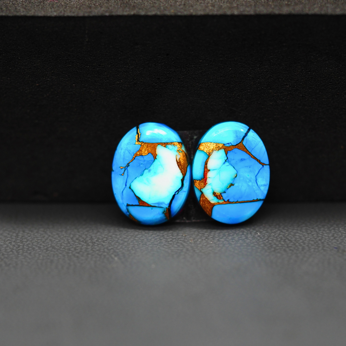 Kingman Ice Blue Dahlia Oval Cabochon Pair 14x11x3mm 9ct - icy blue and white stone with copper veining - Pedra Gems